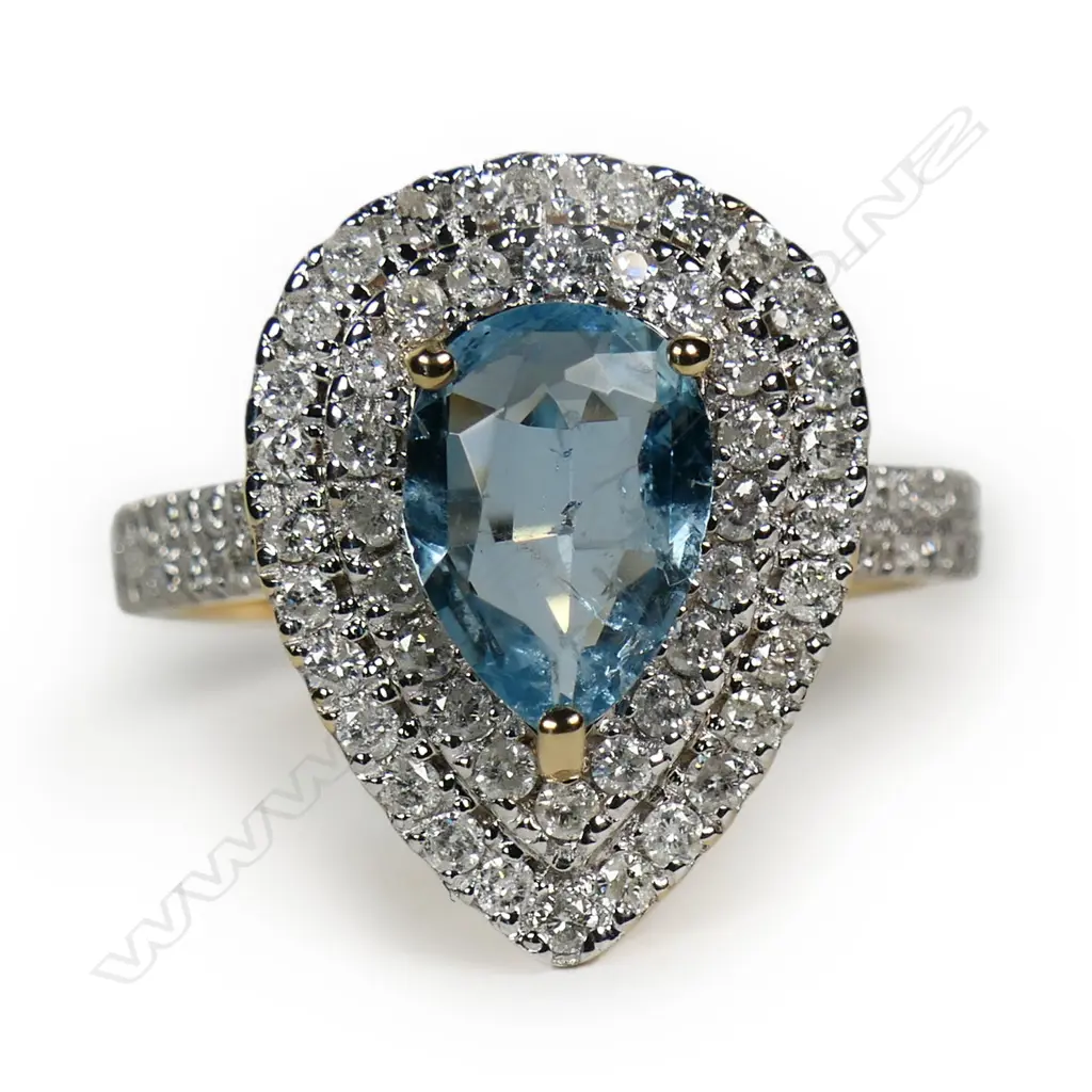 A 14ct gold aquamarine and diamond double halo ring, Image 1++