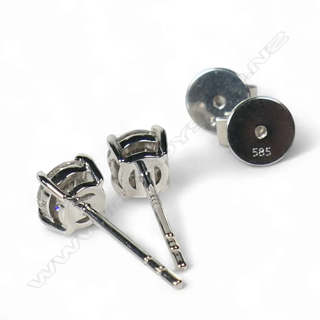 A pair of 14ct white gold and diamond stud earrings, Image 1++