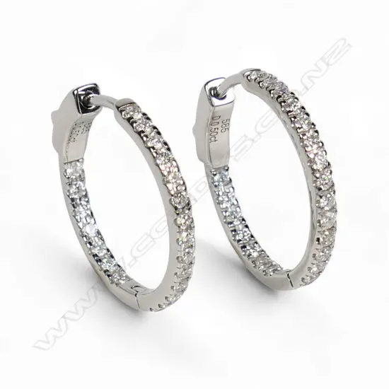 A pair of 14ct white gold and diamond hoop earrings,