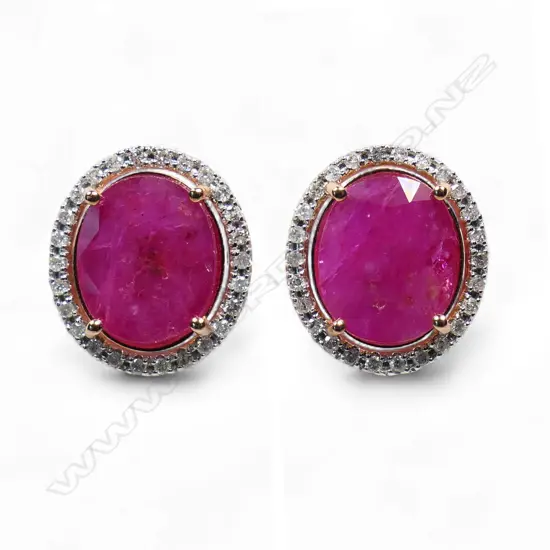 A pair of 14ct rose gold ruby and diamond halo stud earrings,