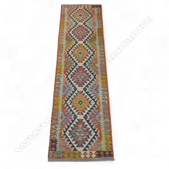 A hand-woven kilim runner,