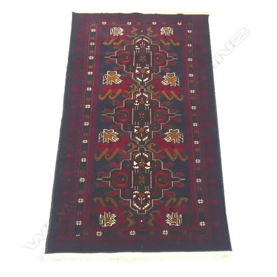 A hand-knotted Baluchi rug,