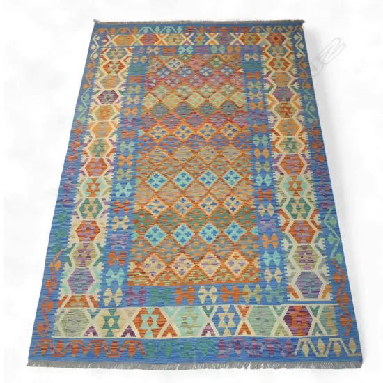 A hand-woven kilim carpet,