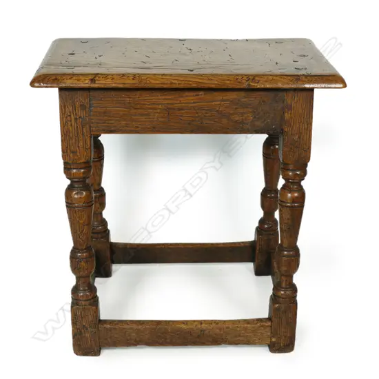 A Georgian oak country stool,