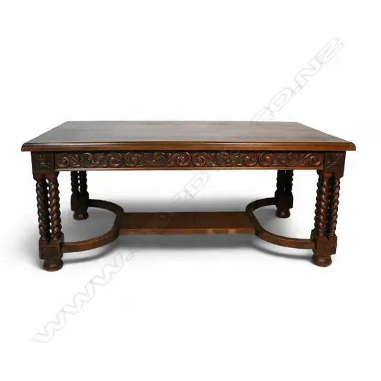 An impressive oak dining table,