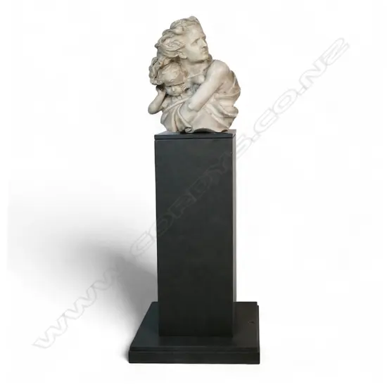 A marble sculpture of a mother and child,