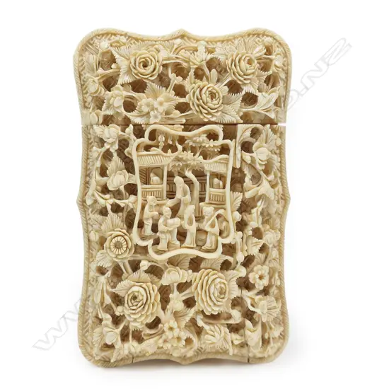 A 19thC ornately carved ivory card case,