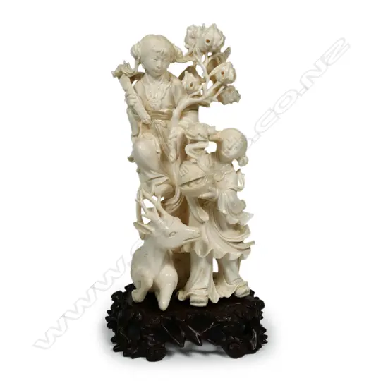 A finely carved Chinese ivory figure group,