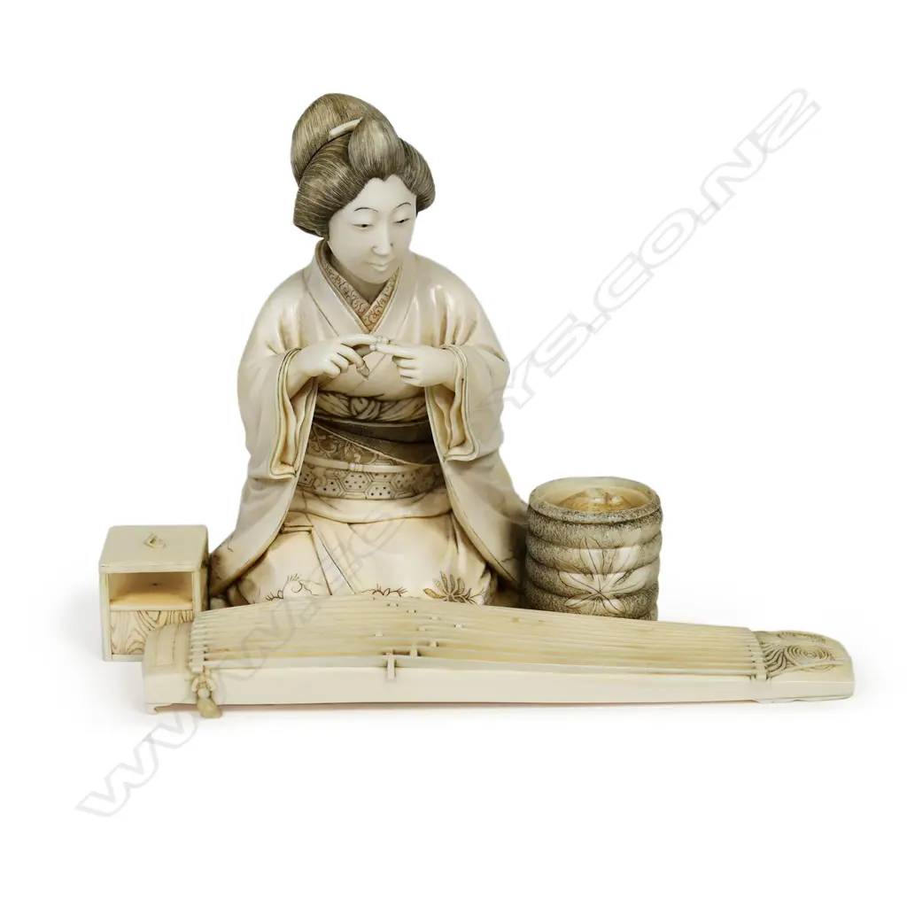A finely carved Japanese ivory figure, Image 1++
