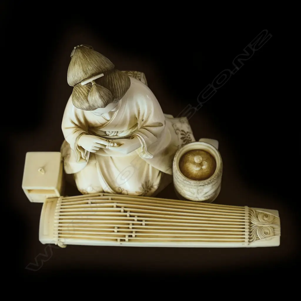 A finely carved Japanese ivory figure, Image 1++