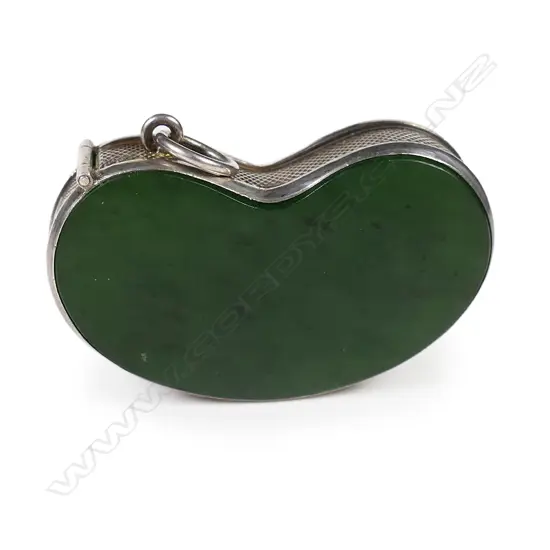 An uncommon early 20thC silver and pounamu lucky bean vesta,
