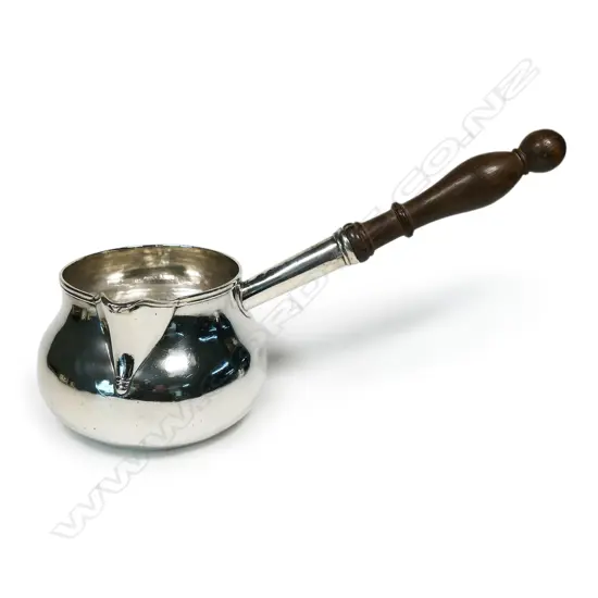 An impressive extra-large George III Irish silver brandy warmer,