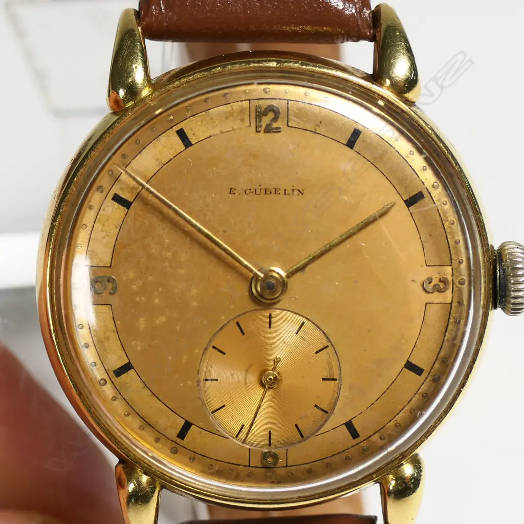 A c.1940's E. Gübelin gent's 18ct yellow gold wrist watch, Image 1++