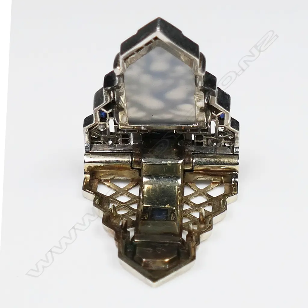 A quality Art Deco 18ct white gold carved hardstone sapphire and diamond dress clip, Image 1++
