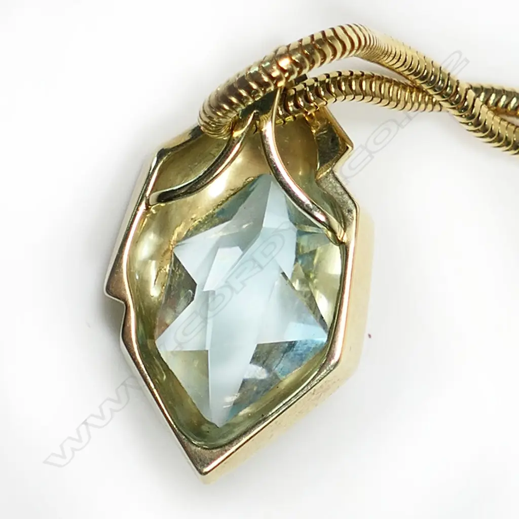 A 14ct gold and aquamarine modernist pendant, Image 1++