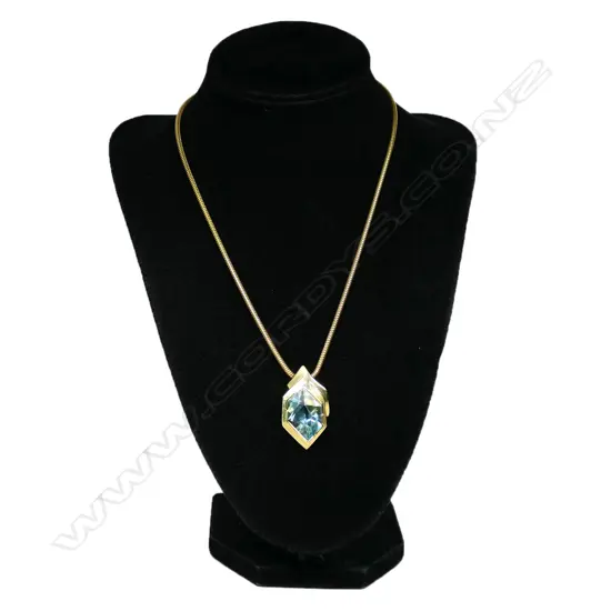 A 14ct gold and aquamarine modernist pendant,