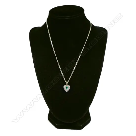 An 18ct white gold emerald and diamond necklace,