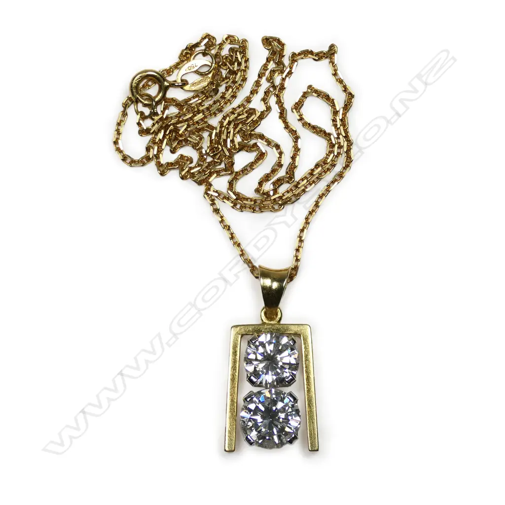 A retro 18ct gold and diamond pendant - a 1.56ct round brilliant cut diamond (Colour I, Clarity I), together with a 1.14ct round brilliant cut diamond (Colour J, Clarity VVS), claw set vertically in white gold, between a yellow gold frame, suspension bale and with fine 18ct gold chain. TDW. 2.70ct. Replacement valuation of $72,500.00. Image 1++