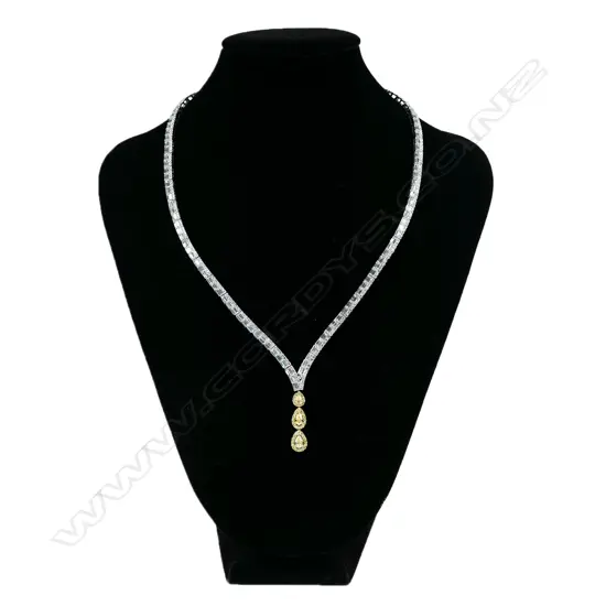 An impressive 18ct white gold with white and yellow diamond pendant necklace,