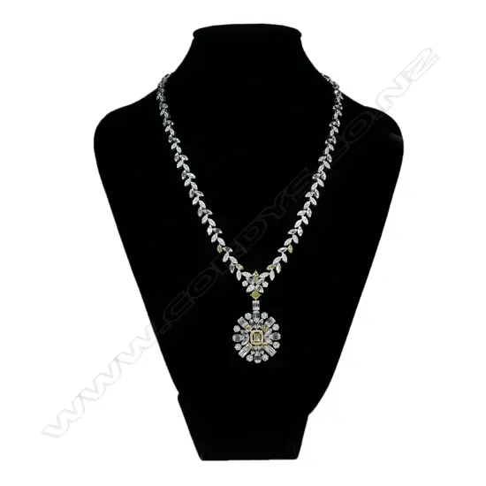 An impressive 18ct white gold with white and yellow diamond pendant necklace,