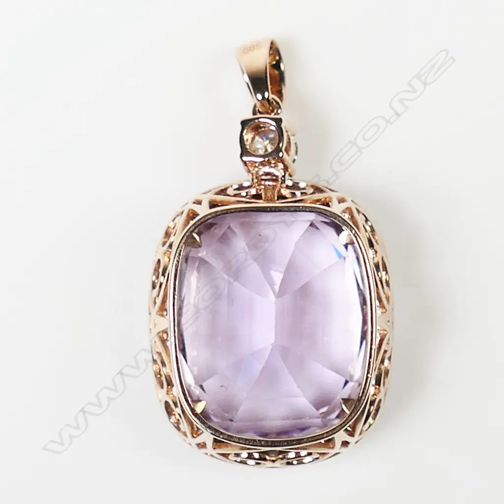 A 14ct rose gold kunzite and diamond halo pendant, Image 1++