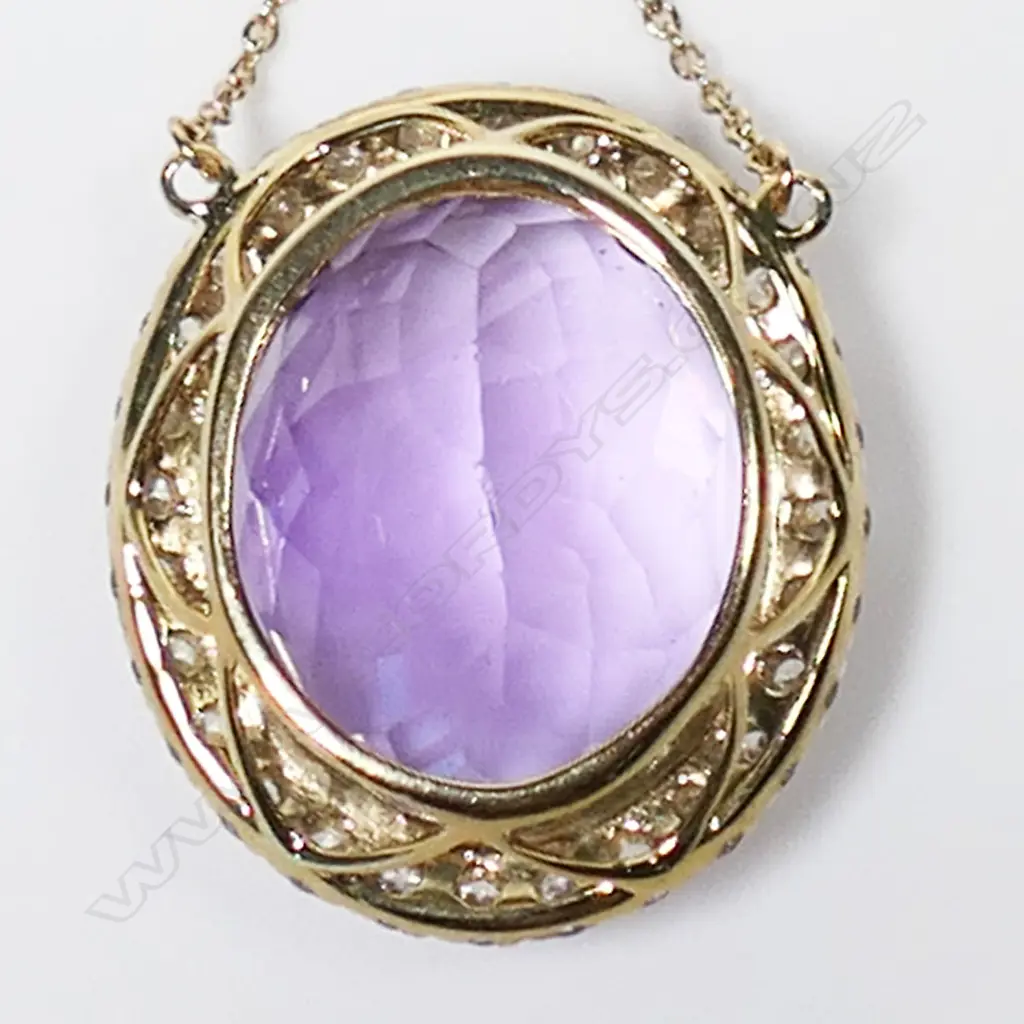 A 10ct gold diamond and amethyst necklace, Image 1++