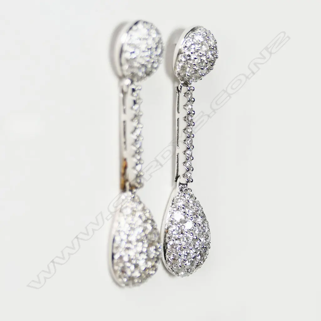 A pair of 18ct white gold and diamond drop earrings, Image 1++