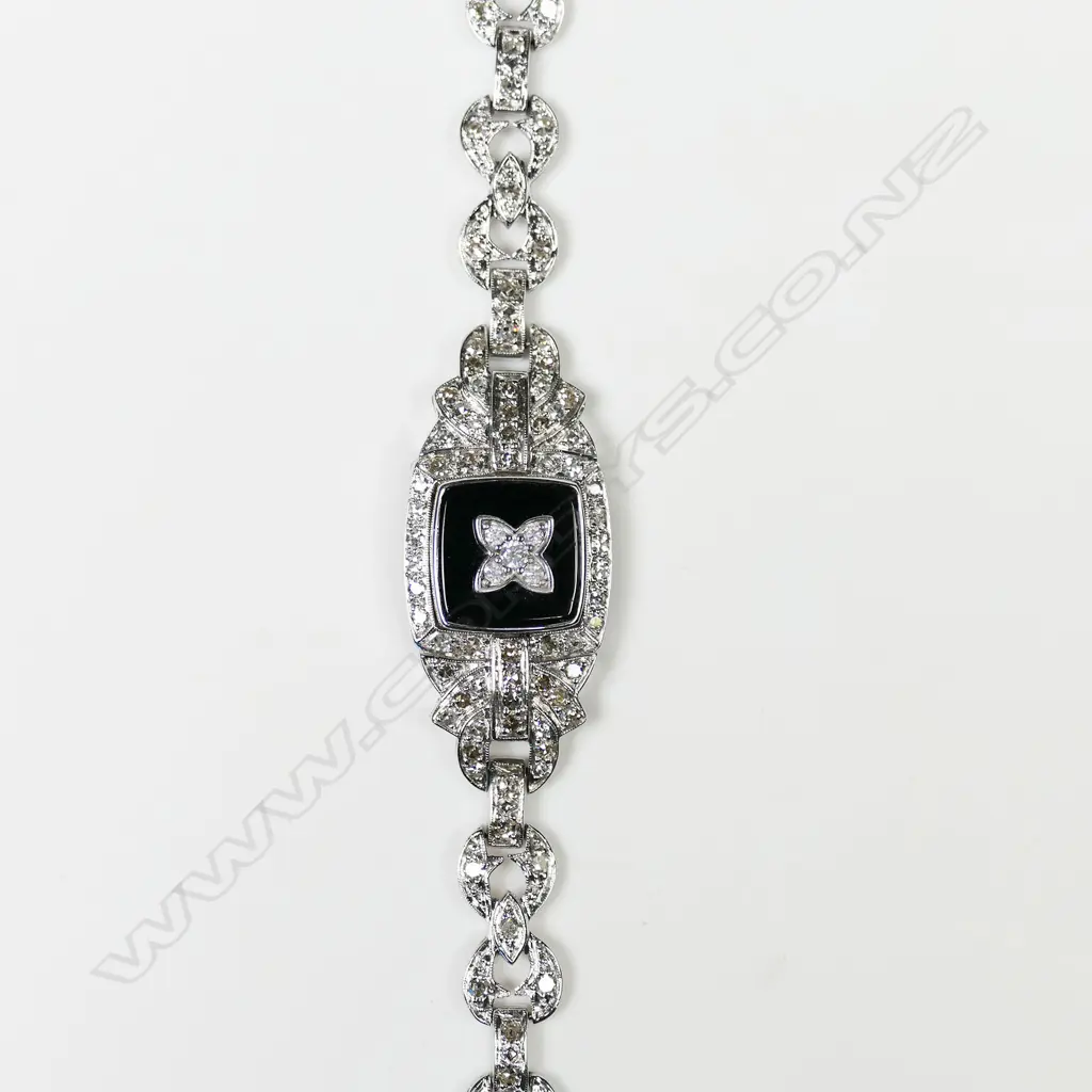 A 14ct white gold diamond and onyx Art Deco style bracelet, Image 1++