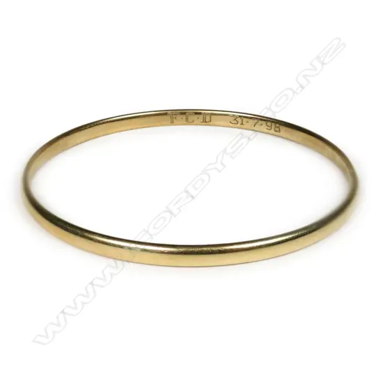 A 9ct gold bangle,