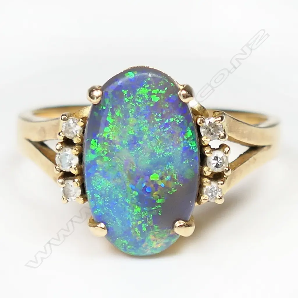A 14ct gold opal and diamond ring, Image 1++