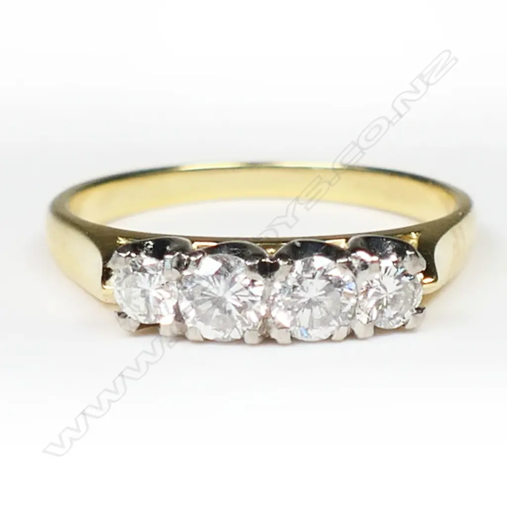 An estate 18ct gold and four stone diamond ring, Image 1++