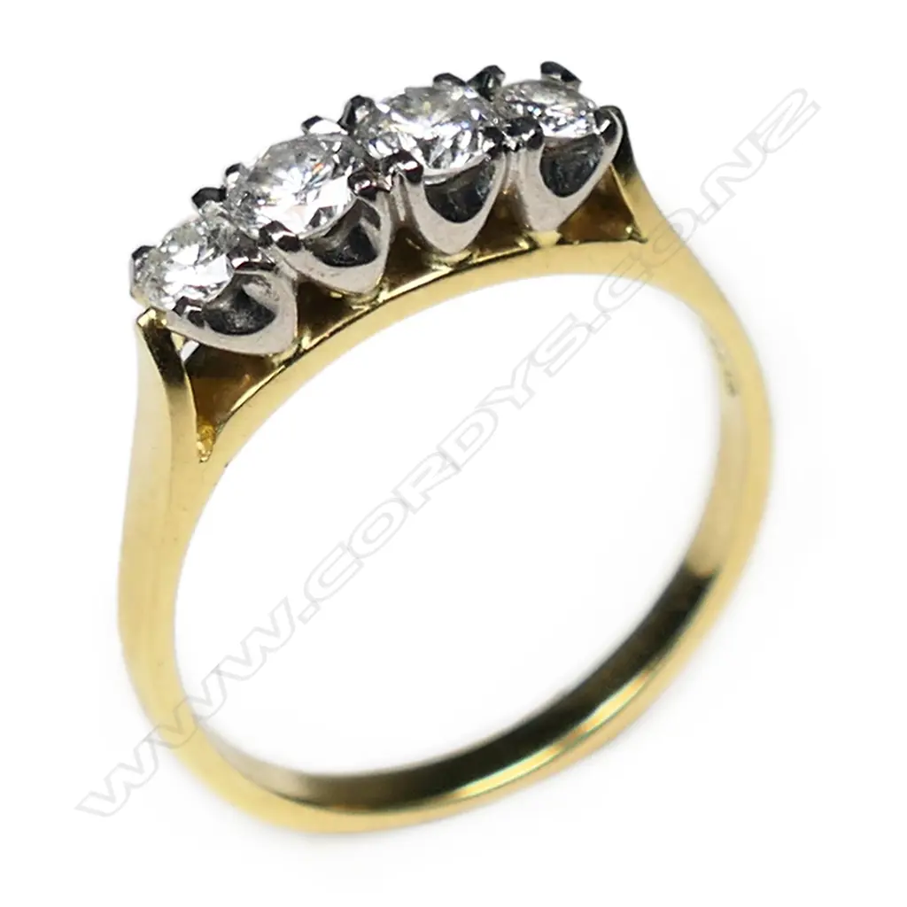 An estate 18ct gold and four stone diamond ring, Image 1++