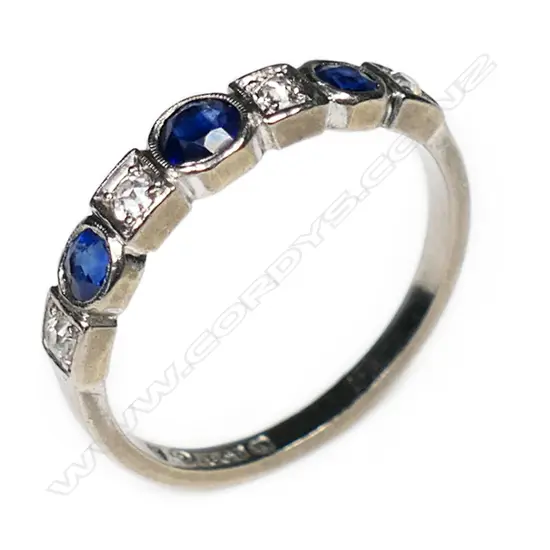 An 18ct white gold sapphire and diamond band,