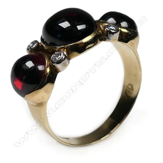 A vintage designer 9ct yellow gold large garnet and diamond ring,