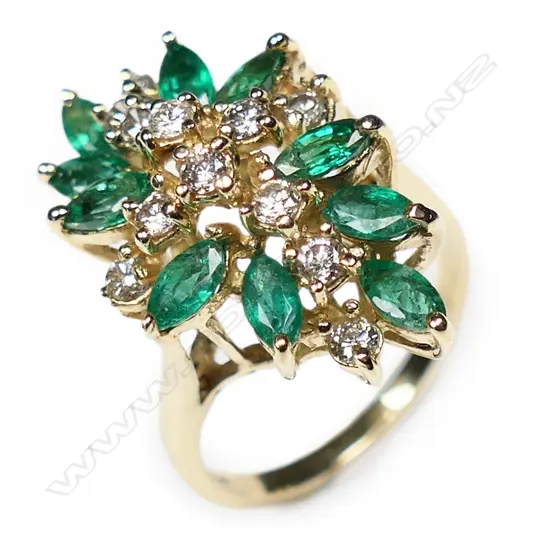 A 14ct gold diamond and emerald dress ring,
