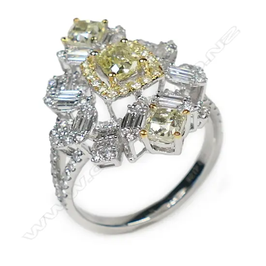 An 18ct white gold and white and yellow diamond ring,