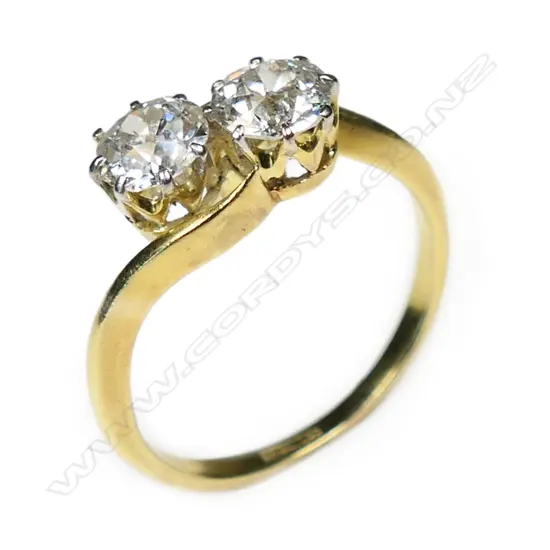 An estate 18ct gold and two stone diamond ring,