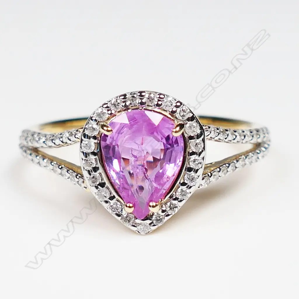 A 14ct yellow and white gold pink sapphire and diamond halo ring, Image 1++
