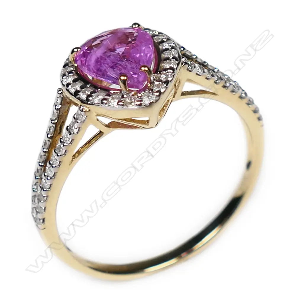 A 14ct yellow and white gold pink sapphire and diamond halo ring, Image 1++