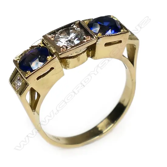 An estate 18ct yellow gold modified sapphire and diamond five stone ring,