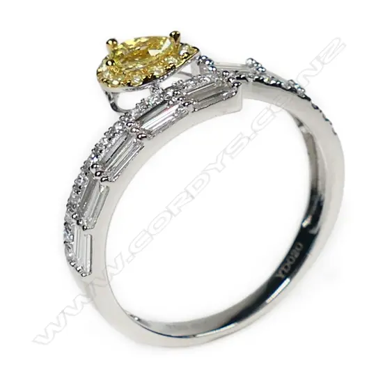 An18ct white gold with white and yellow diamond ring,