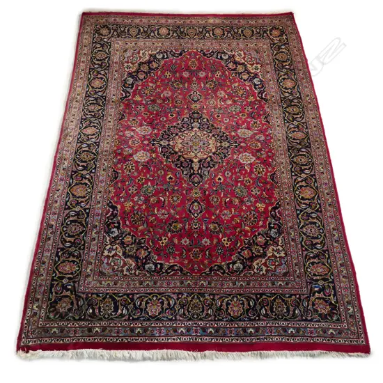A hand-knotted Persian Mashhad carpet,