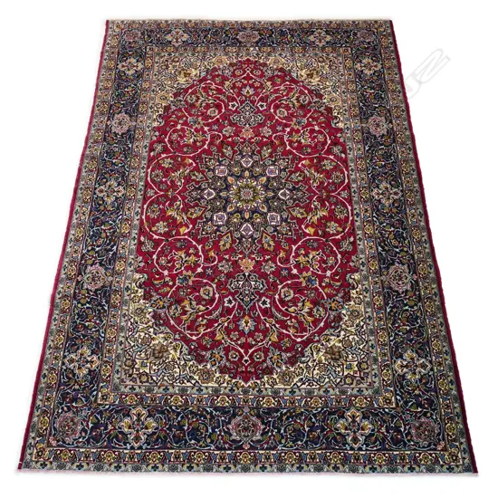 A large quality wool and silk Iranian Isfahan rug,