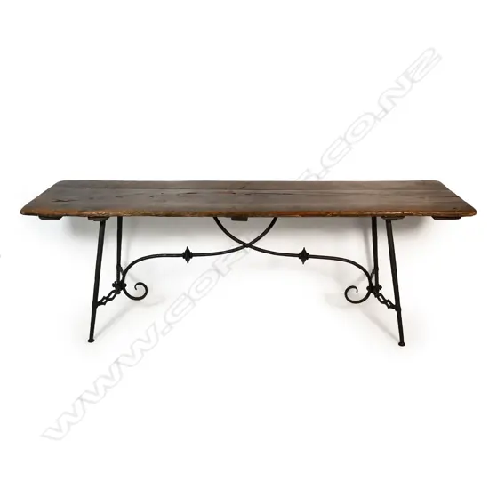 A Spanish fruitwood dining table,