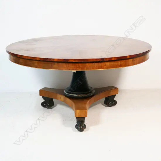 An uncommon early 19thC Austrian Empire round tilt top dining table,