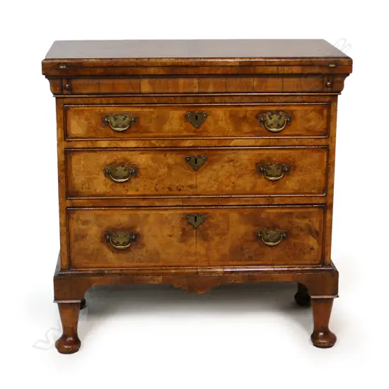 An uncommon quality George III walnut flip top bachelors chest,