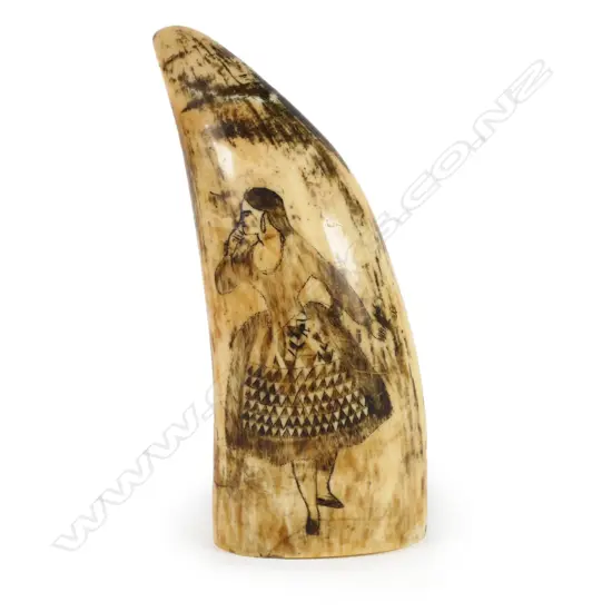 A 19thC whale tooth with original scrimshaw decoration,