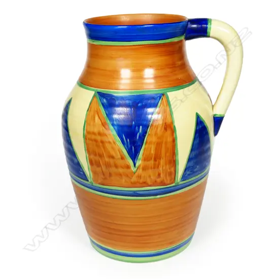 Clarice Cliff original Bizarre large Lotus jug - with a broad band of painted diamond design. Black printed marks to base. C.1929. Hairline crack to the top rim. H.290mm.