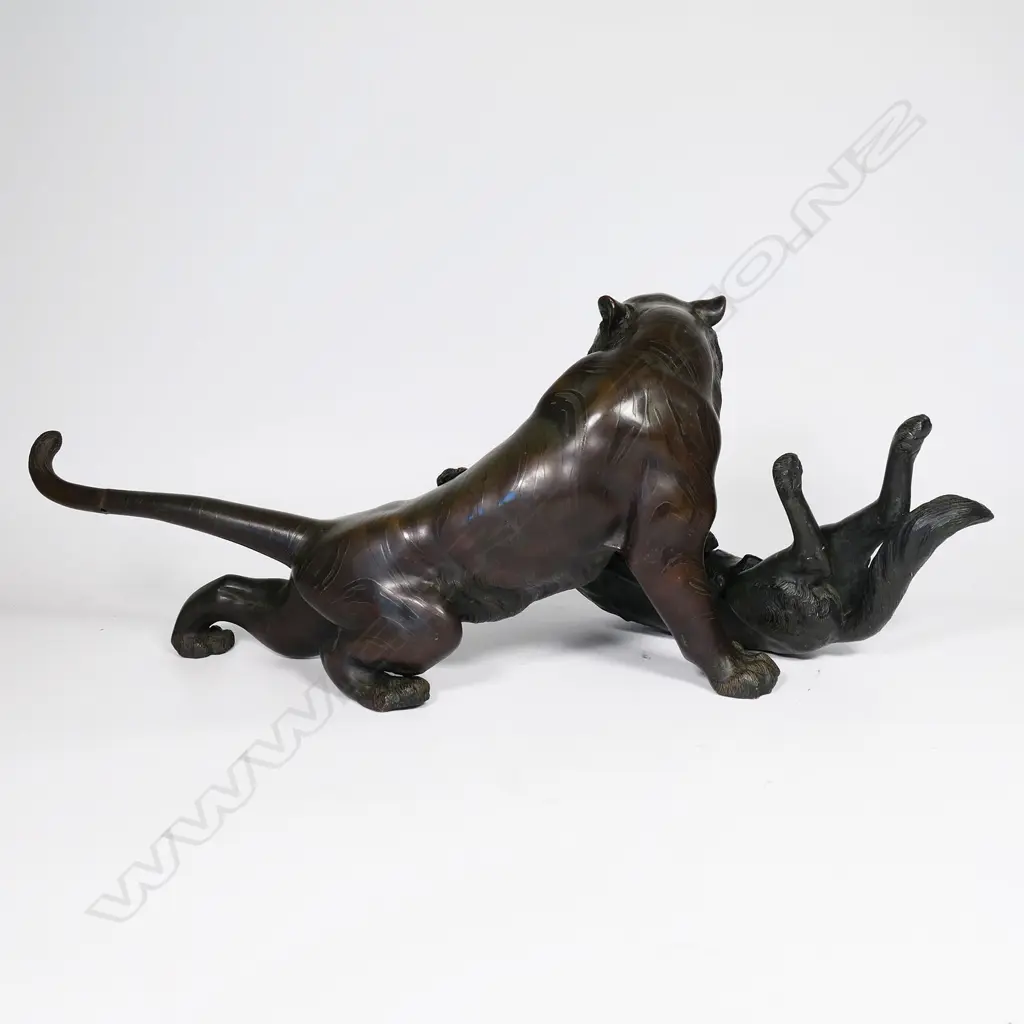 A large Japanese Meiji bronze figural group of a tiger being attacked by a wolf, Image 1++