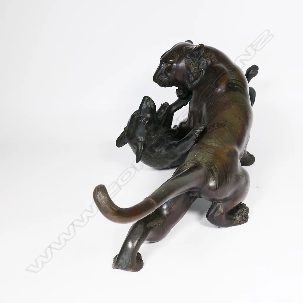 A large Japanese Meiji bronze figural group of a tiger being attacked by a wolf, Image 1++